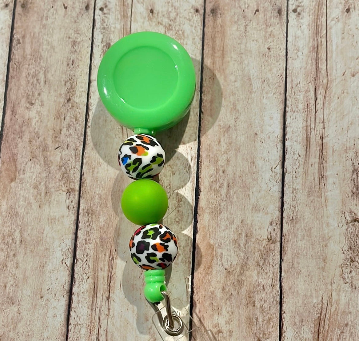 Green leopard badge reel